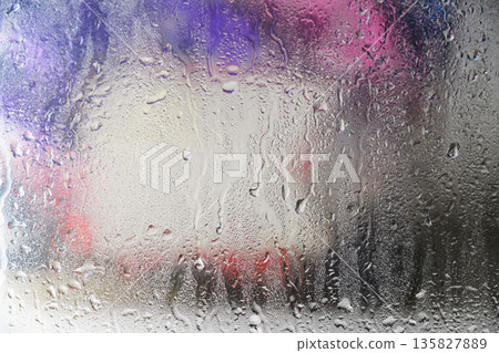 A close-up view of a gray painted surface featuring vertical liquid streaks and drips, creating a grunge industrial background for design projects A close-up view of a gray painted surface featuring vertical liquid streaks and drips, creating a grunge industrial background for design projects 135827889