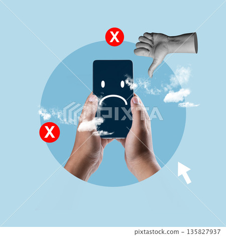 Surreal collage of hands holding a smartphone with a sad emoji, surrounded by thumbs down and 'X' symbols, representing cyberbullying, negative feedback, and social media stress 135827937