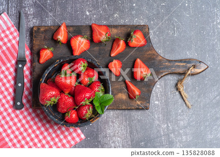 Strawberries On Wooden Cutting Board With Knife 135828088
