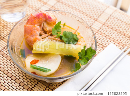 Thai soup with seafood and vegetables Thai soup with seafood and vegetables 135828295