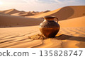 A vessel (pot) placed on the sand 135828747