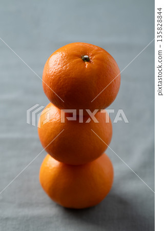 Mandarin tangerine orange fruit on fabric background 135828844