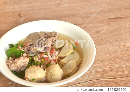 slice Vietnamese sausage and chop pork couple liver with meatball in clear soup on bowl   135829561