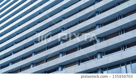 Modern office building facade pattern repetitive horizontal lines windows blue glass texture skyscraper exterior business district architecture detail geometric background wall Modern office building facade pattern repetitive horizontal lines windows blue glass texture skyscraper exterior business district architecture detail geometric background wall 135830703