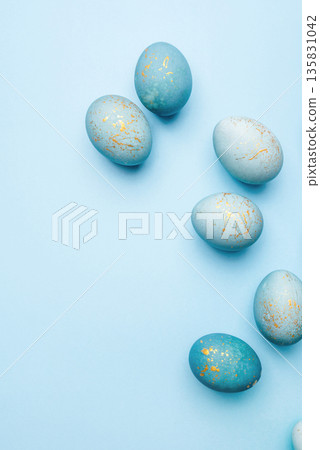 Easter background of eggs painted in blue color. 135831042