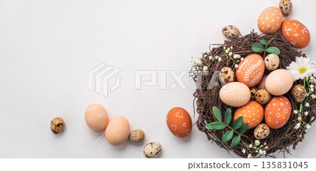 Easter nest with hand-painted eggs on a light background Easter nest with hand-painted eggs on a light background 135831045