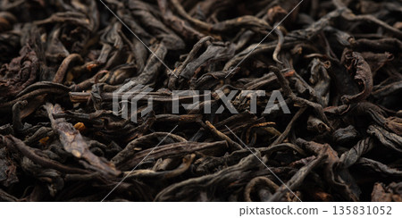 Pile of black tea on white background. Pile of black tea on white background. 135831052