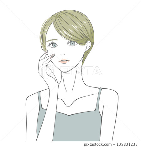 A blonde woman with her hand on her right cheek 135831235