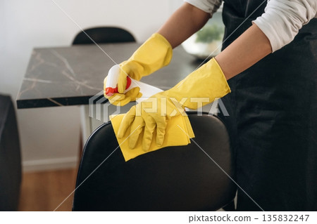 Female professional cleaning service worker is domestic room Female professional cleaning service worker is domestic room 135832247