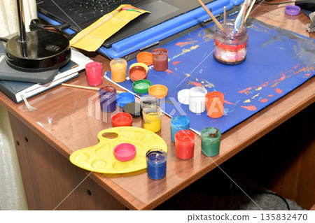 Workplace of an artist painting with watercolors. 135832470