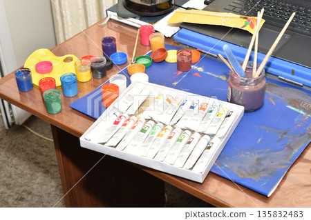 Workplace of an artist painting with watercolors. 135832483