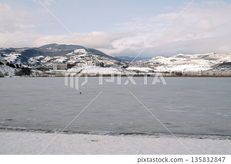 Lisi lake frozen in winter, small lake and popular recreation area in Tbilisi, Georgia Lisi lake frozen in winter, small lake and popular recreation area in Tbilisi, Georgia 135832847