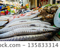 Fresh fish sale at local market in early morning. Freh seafood in ice on counter in a grocery store 135833314