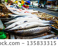 Fresh fish sale at local market in early morning. Freh seafood in ice on counter in a grocery store 135833315