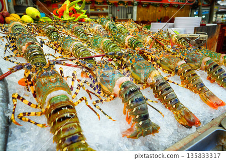 Fresh lobsters on ice at local market in beach town. Lobsters market in beach town. Fresh seafood Fresh lobsters on ice at local market in beach town. Lobsters market in beach town. Fresh seafood 135833317