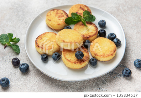 Cottage cheese pancakes with blueberries and mint for breakfast 135834517