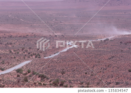 Dusty Valley Drive in Monument Valley during a sandstorm 135834547