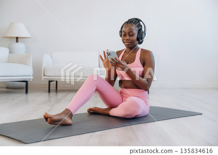Break time. Woman is doing yoga at home 135834616