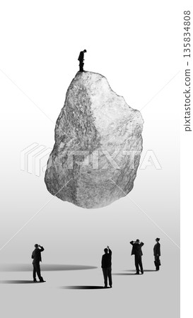 Graphic composition of businessman standing on massive stone above observing group. Collage of 3 models 135834808