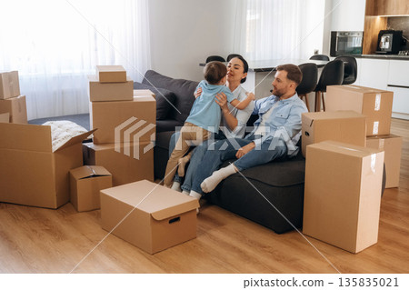 Finally some rest. Family of husband, wife and son are moving into new house 135835021