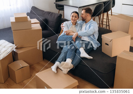 Success, resting. Happy couple moved into new house Success, resting. Happy couple moved into new house 135835061