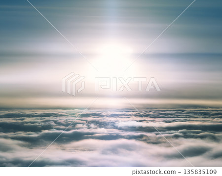 Aerial view of the sea of clouds and the sun above 135835109