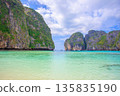 Spectacular resort scenery of Maya Beach on Phi Phi Island in Thailand, with its emerald green sea and limestone cliffs 135835190