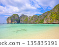 Spectacular resort scenery of Maya Beach on Phi Phi Island in Thailand, with its emerald green sea and limestone cliffs 135835191