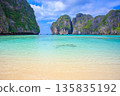 Spectacular resort scenery of Maya Beach on Phi Phi Island in Thailand, with its emerald green sea and limestone cliffs 135835192