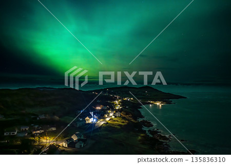 The Aurora Borealis, the northern lights, showing up above Portnoo harbour in County Donegal, Ireland The Aurora Borealis, the northern lights, showing up above Portnoo harbour in County Donegal, Ireland 135836310