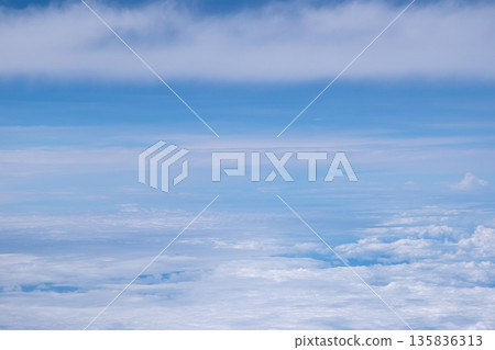 Aerial view of sky and cloud seen from window of airplane 135836313