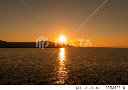 Sunset seen from the ferry between Kuchinotsu Port and Oniike Port Sunset seen from the ferry between Kuchinotsu Port and Oniike Port 135836348