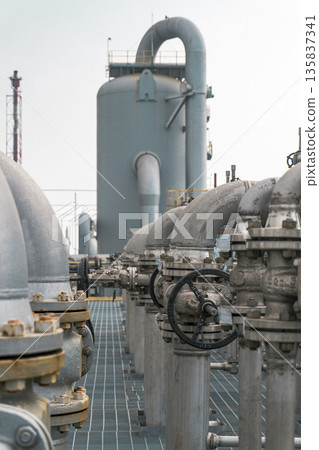 Large industrial plant with many pipes and valves Large industrial plant with many pipes and valves 135837341