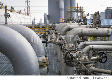 Large industrial plant with many pipes and valves 135837342