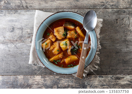 Cod with potatoes on wooden table Cod with potatoes on wooden table 135837750