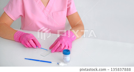 Laboratory technician in pink gloves preparing medical test sample on white table. Healthcare, diagnostics, analysis and clinical research concept with copy space. 135837888