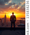 Successful Businessman in Suit Standing on Rooftop Looking at City Skyline During Sunset, Visionary Leadership and Future Business Goals Concept, Cinematic Golden Hour Lighting on Skyscraper. 135838236