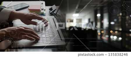 Working late in a quiet office. Working late in a quiet office. 135838246