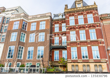 Canal Houses facade of Amsterdam City in Netherlands street building architecture. Canal Houses facade of Amsterdam City in Netherlands street building architecture. 135838796