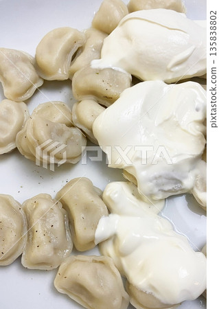 Delicious Pelmeni with Creamy Sour Cream Delicious Pelmeni with Creamy Sour Cream 135838802
