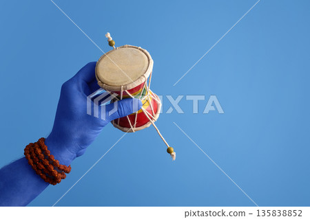 Maha Shivratri. Blue Lord Shiva hand holding damaru with rudraksha mala Maha Shivratri. Blue Lord Shiva hand holding damaru with rudraksha mala 135838852