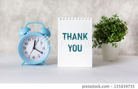 A notebook with a thank you message, a business concept and a thank you symbol A notebook with a thank you message, a business concept and a thank you symbol 135839735