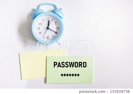 A secret password written on a sticker next to the alarm clock on a white background A secret password written on a sticker next to the alarm clock on a white background 135839736