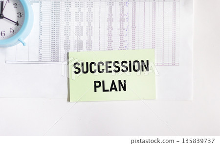 The success plan is written on a sticker that lies on the document The success plan is written on a sticker that lies on the document 135839737