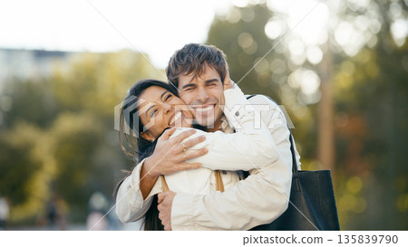 Happy couple embracing outdoors showing affection and joy 135839790