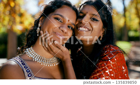 Indian women smiling together showing friendship and tradition 135839850