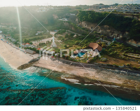 Most famous Pandawa beach with lighthouse, blue ocean and sunshine in Bali island. 135840521