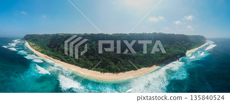 Panoramic aerial view of coastline with ocean waves in Bali. Panoramic aerial view of coastline with ocean waves in Bali. 135840524