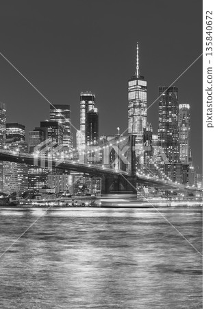 Black and white photo of Manhattan waterfront at night, New York City, USA. 135840672