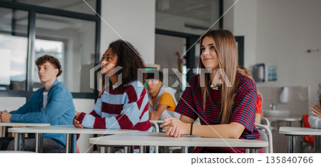 Confident teen students during lesson in modern classroom. Confident teen students during lesson in modern classroom. 135840766